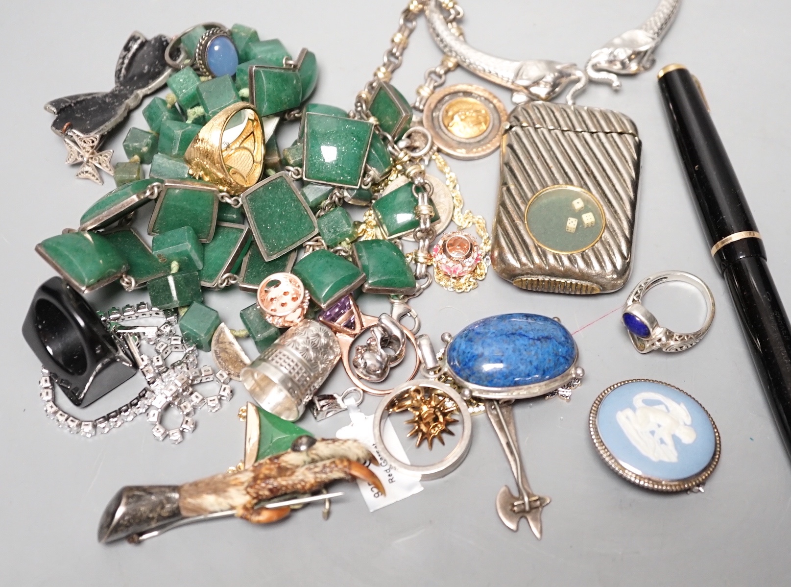 An early 20th century Cymric sterling and enamel brooch, 29mm, a silver nurses buckle and a group of assorted mainly costume jewellery.